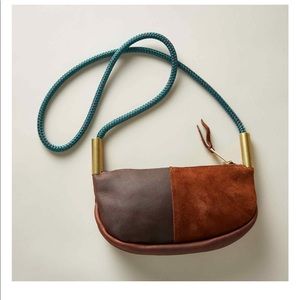 Wildwood Oyster Co.  from Maine. Small Brown leather handbag with teal strap.